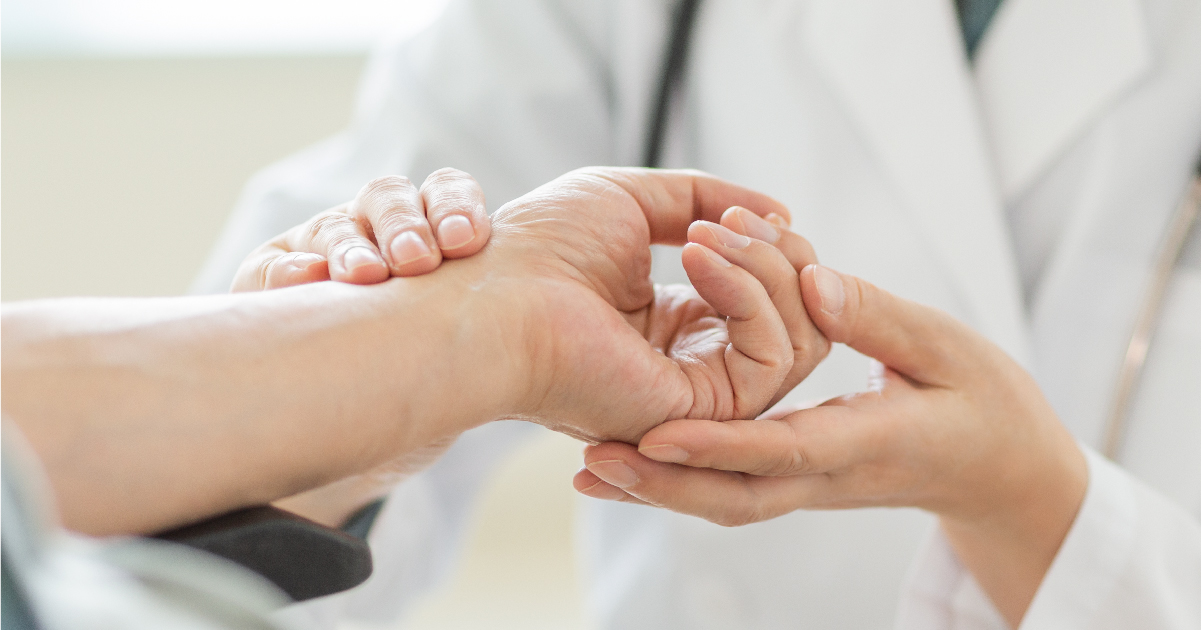 Practitioner Doing Pulse Diagnosis of Patient with Thyroid Disease