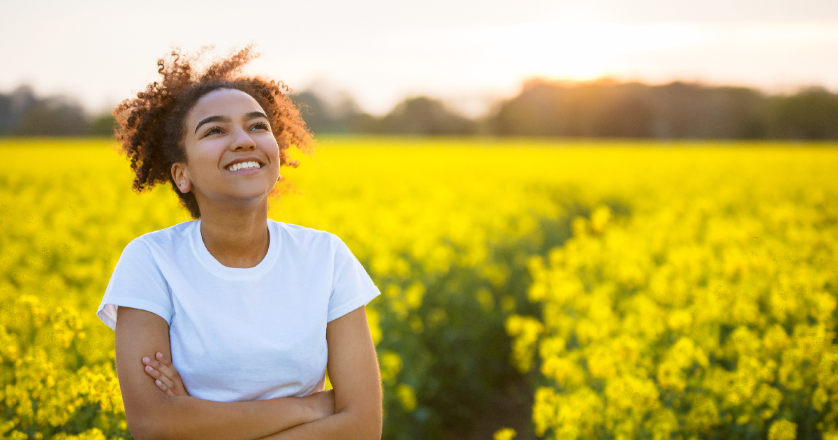 Woman in a flied engaging her feel-good hormones